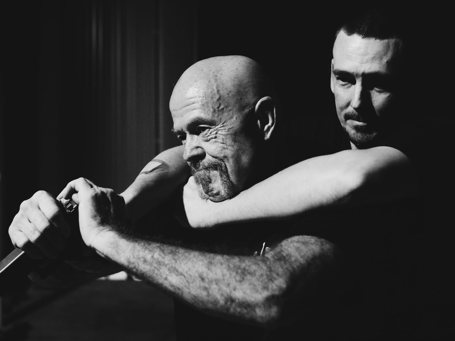 Two men practicing self-defense techniques.