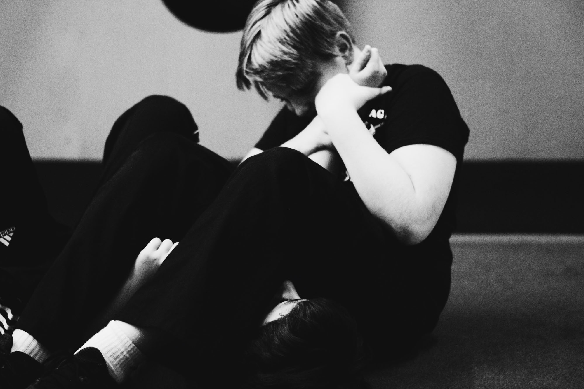 Two people practicing martial arts grappling.